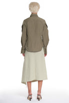 RAIN PROOF SHIRT WITH OPEN SLEEVES, CUTTING AND BUTTONING ON EACH OF THEM, OPEN COLLAR, OVERLAPPING IN FRONT