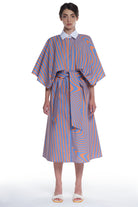 PRINTED LONG SHIRT-DRESS, BUTTONING IN FRONT, HIGH COLLAR, TIED WITH A BELT IN FRONT