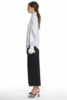 LONG SLEEVE SHIRT WITH BUTTONING ON THE FRONT, HIGH COLLAR, RUFFLED LAYERS ON THE SLEEVES
