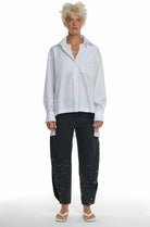 LONG SLEEVE COTTON SHIRT WITH TWO DIFFERENT TYPES OF COLLAR, CUTTINGS IN FRONT AND ON THE SHOULDERS, LONGER ON THE BACK