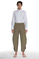 RAIN PROOF LONG PANTS WITH CUTTINGS AND BUTTONING ON THE SIDES