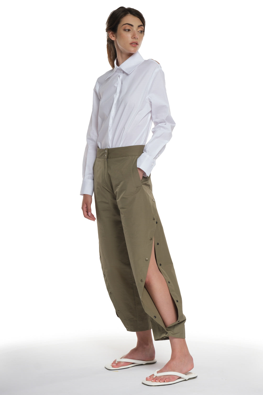 RAIN PROOF LONG PANTS WITH CUTTINGS AND BUTTONING ON THE SIDES