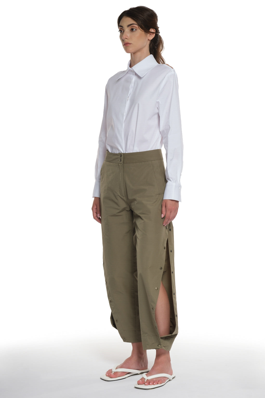 RAIN PROOF LONG PANTS WITH CUTTINGS AND BUTTONING ON THE SIDES