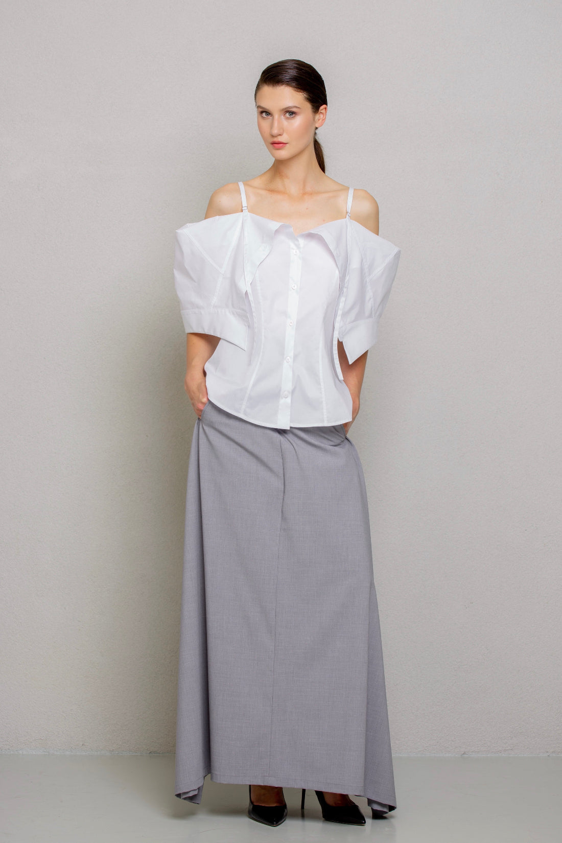 a white off-the-shoulder blouse with dramatic puffed sleeves 