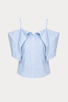 A light blue button-up blouse with unique draped shoulder panels and thin shoulder straps