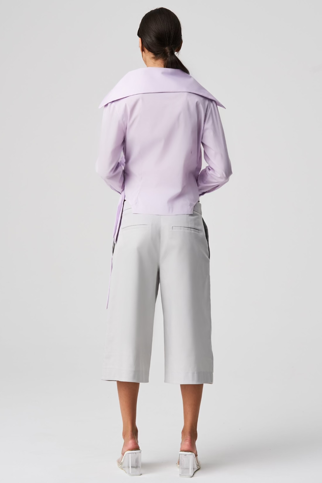 light purple shirt and gray pants