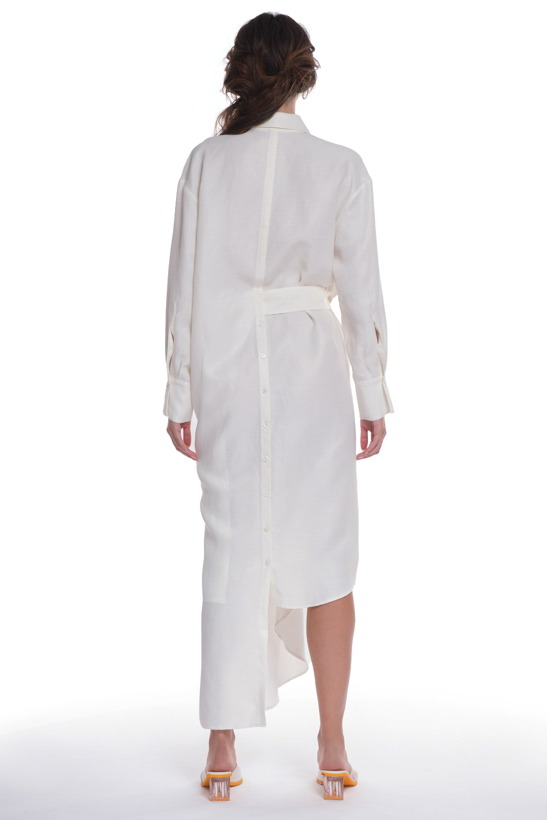 ASYMMETRICAL LONG SHIRT-DRESS WITH RUFFLE ON THE SIDE, OPEN COLLAR, TIED WITH A BELT, BUTTONING ON THE BACK