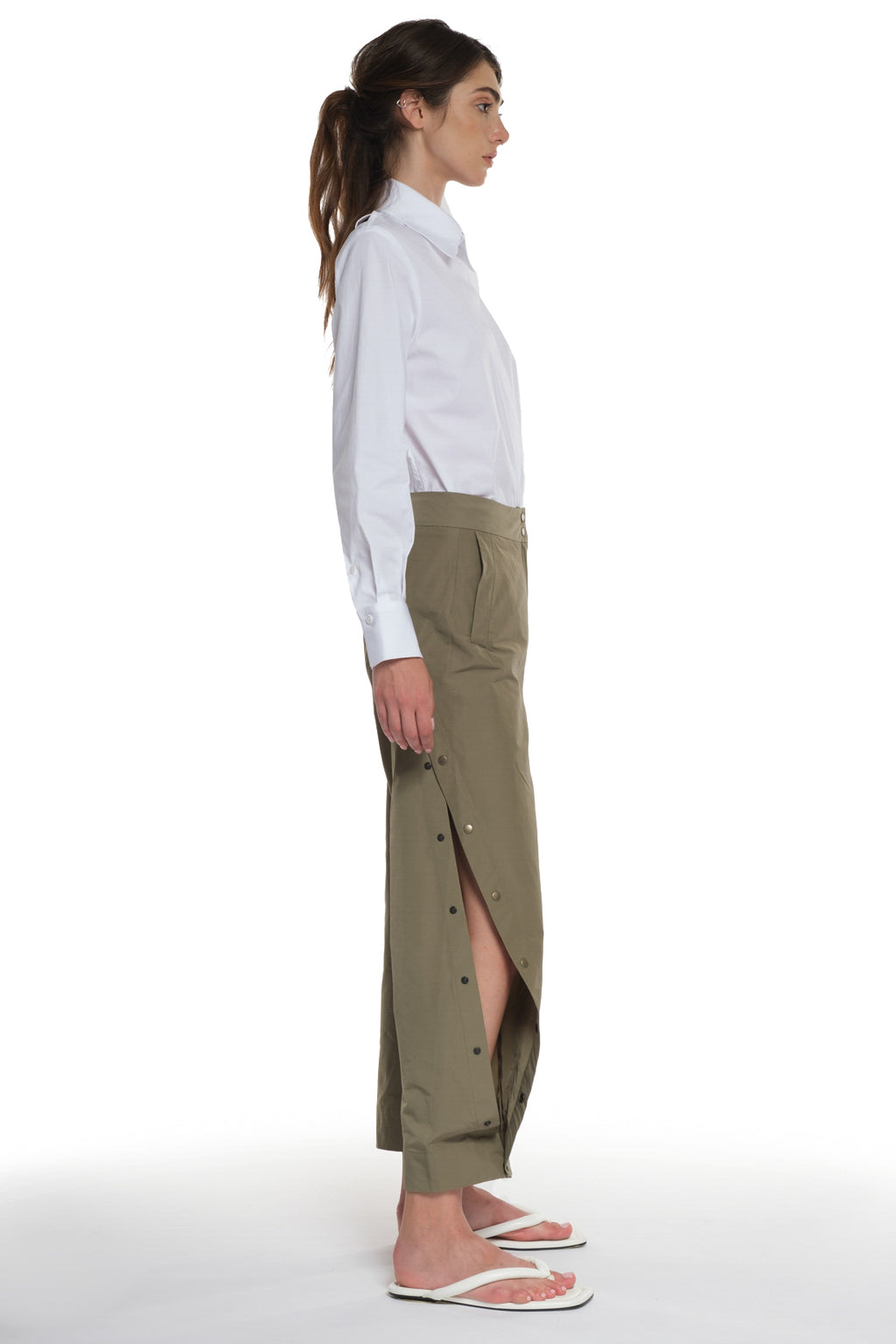 RAIN PROOF LONG PANTS WITH CUTTINGS AND BUTTONING ON THE SIDES